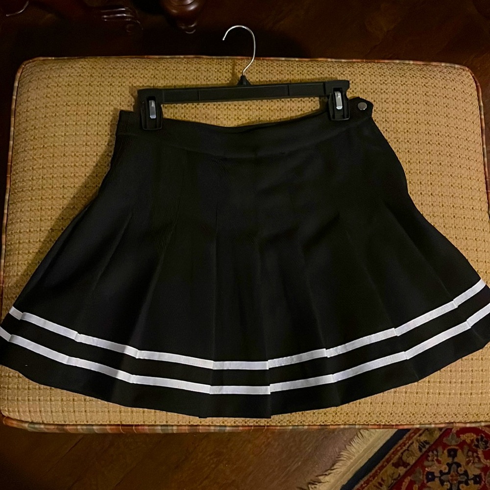 Black mini skirt. Never worn.